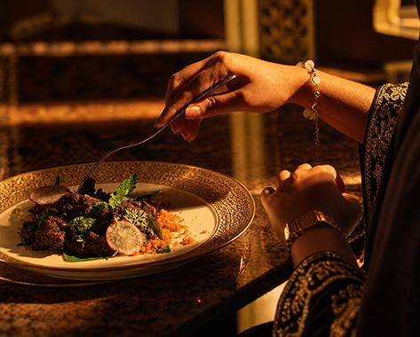 A guest enjoying a carefully plated dish