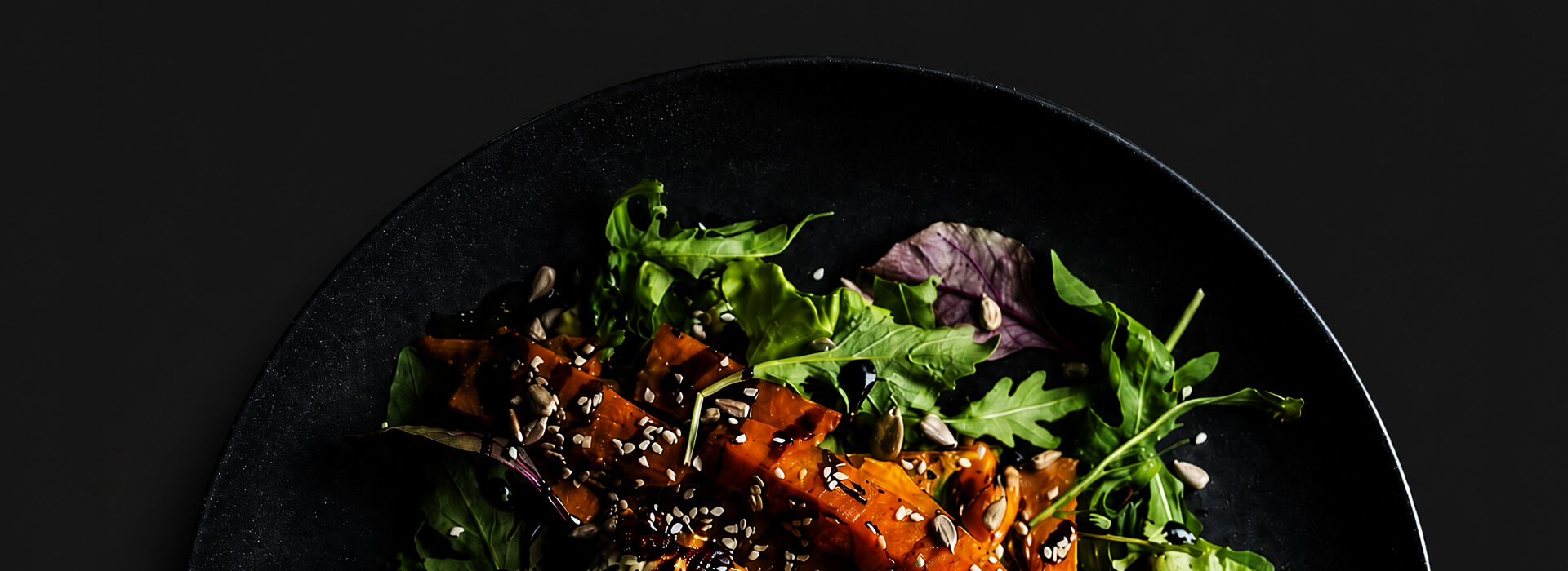 A carefully composed plate of grilled vegetables and greens